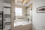 En-suite bathroom with large soaking tub/shower combo